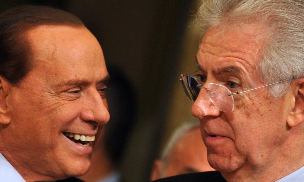 Former prime minister Silvio Berlusconi (left) has returned to Italy's political scene in advance of next month's election. Also in the race is the current Prime Minister Mario Monti (right). They are shown here in November 2011 as Monti took over for Berlusconi.