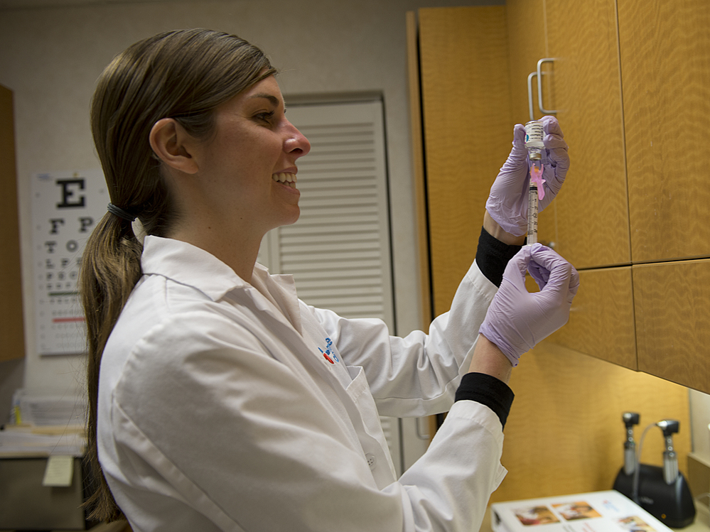 Shea Catlin, a nurse practitioner, doses out flu vaccine to give a shot at a CVS Minute Clinic in Arlington, Va., on Jan. 3. Shea Catlin, a nurse practitioner, doses out flu vaccine to give a shot at a CVS Minute Clinic in Arlington, Va., on Jan. 3.