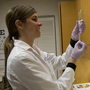Shea Catlin, a nurse practitioner, doses out flu vaccine to give a shot at a CVS Minute Clinic in Arlington, Va., on Jan. 3.