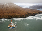 The 266-feet-wide Kulluk oil rig, seen here as it sat aground last Thursday, is being towed 30 miles to the north. The 266-feet-wide Kulluk oil rig, seen here as it sat aground last Thursday, is being towed 30 miles to the north.