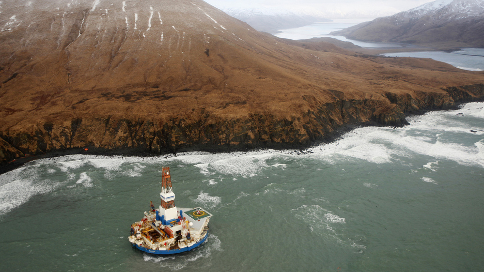 The 266-feet-wide Kulluk oil rig, seen here as it sat aground last Thursday, is being towed 30 miles to the north. The 266-feet-wide Kulluk oil rig, seen here as it sat aground last Thursday, is being towed 30 miles to the north.