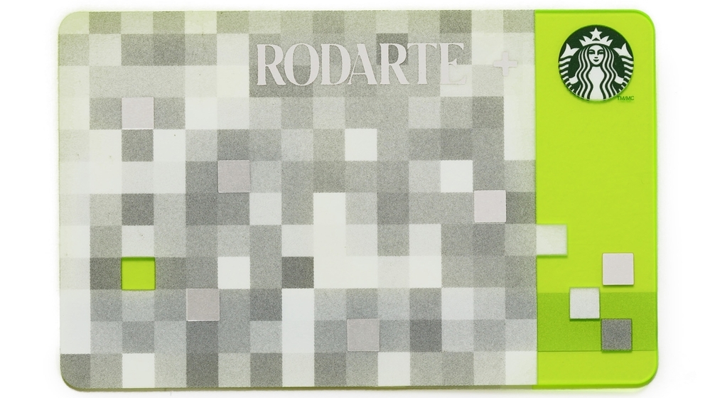 This product image released by Starbucks shows the Rodarte design Starbucks gift card, part of a series of limited-edition products for the holiday season. The card is one of several Rodarte-designed items including tote bags, cup sleeves and mug. The signature pattern features a pixelated checkerboard of gray, white and silver set against different shades of green. This product image released by Starbucks shows the Rodarte design Starbucks gift card, part of a series of limited-edition products for the holiday season. The card is one of several Rodarte-designed items including tote bags, cup sleeves and mug. The signature pattern features a pixelated checkerboard of gray, white and silver set against different shades of green.