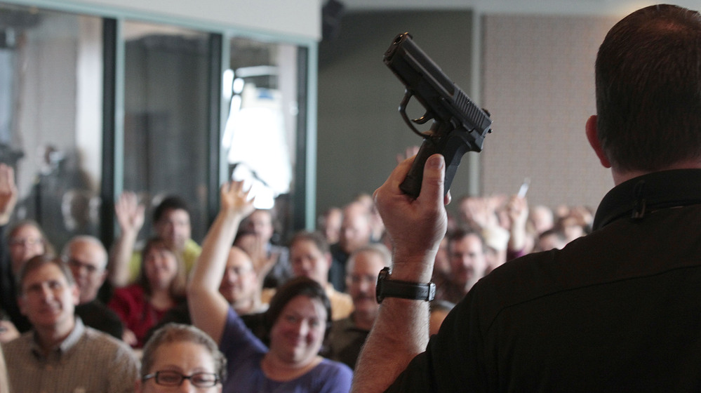 Firearm instructor Clark Aposhian conducts a concealed-weapons class for teachers, sponsored by the Utah Shooting Sports Council, in West Valley City, Utah. Across the country, school districts and other entities are hoping to better prepare staff to respond in a shooting situation.