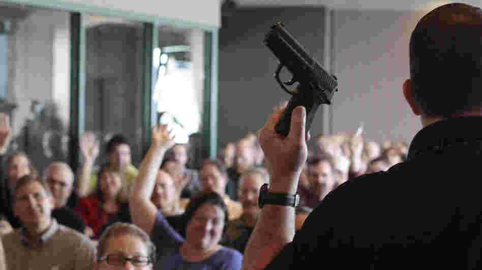 Firearm instructor Clark Aposhian conducts a concealed-weapons class for teachers, sponsored by the Utah Shooting Sports Council, in West Valley City, Utah. Across the country, school districts and other entities are hoping to better prepare staff to respond in a shooting situation.