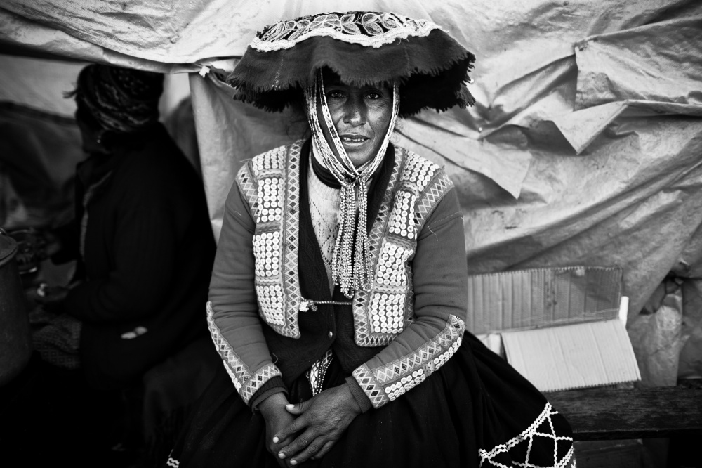 Portrait of a Quechua woman in traditional dress in the Andean town of Ocongate
