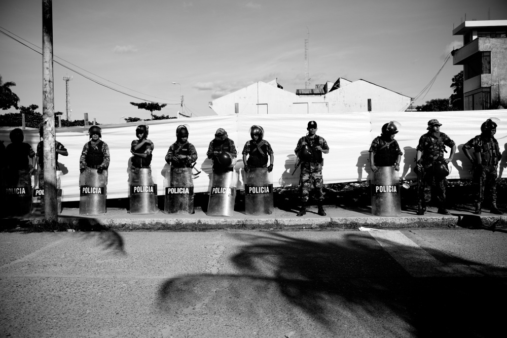 Police line the streets during a miners protest against regulation in April 2010.