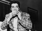 A still-trim Elvis Presley enjoys a sandwich in 1958. His love of fatty foods hadn't caught up to him yet. A still-trim Elvis Presley enjoys a sandwich in 1958. His love of fatty foods hadn't caught up to him yet.