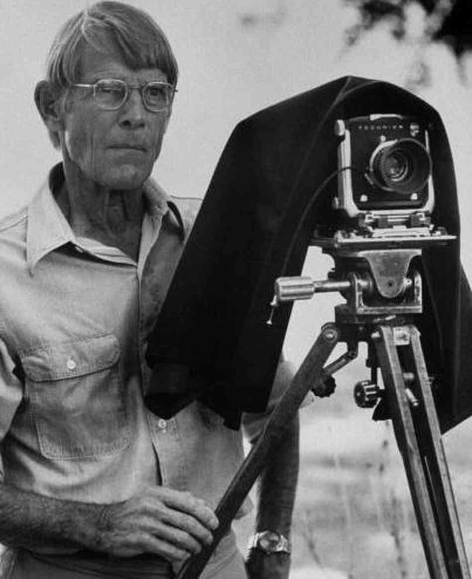 Photographer Eliot Porter outside preparing to use his Technika camera Photographer Eliot Porter outside preparing to use his Technika camera