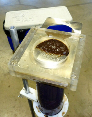 Layers of lake sediment are removed at intervals from a core. In a laboratory, contaminants and biological remains are analyzed from select sediment layers to understand lake history and reconstruct environmental changes that often predate periods of direct monitoring.