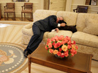 President George W. Bush takes a breather on the couch with his dog Miss Beazley. President George W. Bush takes a breather on the couch with his dog Miss Beazley.