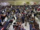 Gun enthusiasts flock to the New Eastcoast Arms Collectors Associates Arms Fair in March 2012 in Saratoga, N.Y. Some local residents would like the next show to be canceled, in light of the Newtown, Conn., school shootings. Gun enthusiasts flock to the New Eastcoast Arms Collectors Associates Arms Fair in March 2012 in Saratoga, N.Y. Some local residents would like the next show to be canceled, in light of the Newtown, Conn., school shootings.