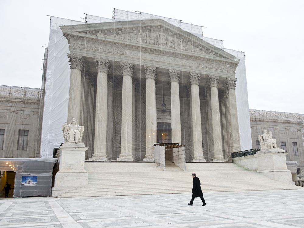 A photographic screen hangs in front of the U.S. Supreme Court, which is undergoing renovations. On Wednesday, the justices will hear arguments in a case that asks whether police without a warrant can administer a blood test to a suspected drunken driver. A photographic screen hangs in front of the U.S. Supreme Court, which is undergoing renovations. On Wednesday, the justices will hear arguments in a case that asks whether police without a warrant can administer a blood test to a suspected drunken driver.
