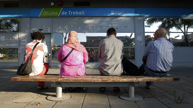 In Badalona, Spain, people waited outside an employment office last summer.