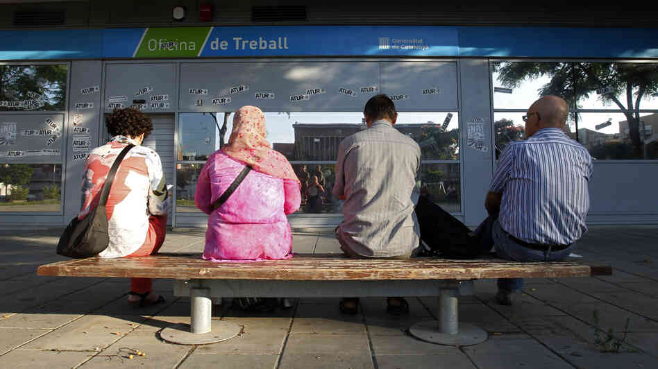 In Badalona, Spain, people waited outside an employment office last summer.