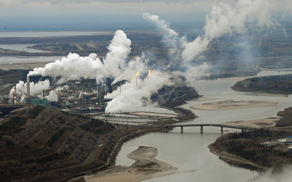 An aerial view of the Suncor oil sands extraction facility on the banks of the Athabasca River in Alberta, Canada, in 2009. Scientists say contaminants found at the bottom of lakes in Alberta are from air pollutants from the facilities responsible for producing and processing tar sands oil.