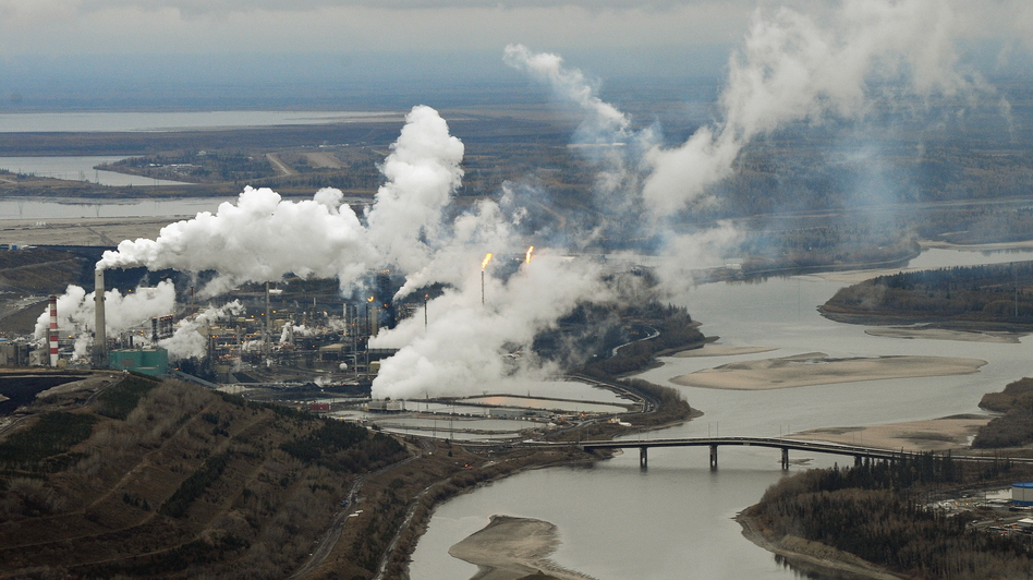 An aerial view of the Suncor oil sands extraction facility on the banks of the Athabasca River in Alberta, Canada, in 2009. Scientists say contaminants found at the bottom of lakes in Alberta are from air pollutants from the facilities responsible for producing and processing tar sands oil.