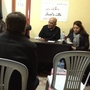 Beit Qamishlo is a modest house in southern Turkey that caters to Syrian exiles seeking temporary refuge. It also hosts frequent discussions on Syria's future. Here, Malik Dagestani (center), a former political prisoner in Syria, talks about his detention in the 1980s and 1990s.