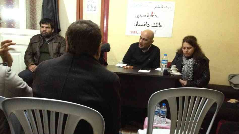 Beit Qamishlo is a modest house in southern Turkey that caters to Syrian exiles seeking temporary refuge. It also hosts frequent discussions on Syria's future. Here, Malik Dagestani (center), a former political prisoner in Syria, talks about his detention in the 1980s and 1990s. Beit Qamishlo is a modest house in southern Turkey that caters to Syrian exiles seeking temporary refuge. It also hosts frequent discussions on Syria's future. Here, Malik Dagestani (center), a former political prisoner in Syria, talks about his detention in the 1980s and 1990s.