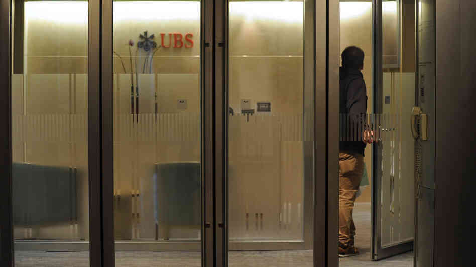 A man enters a UBS bank in Hong Kong last month. The Swiss banking giant agreed in 2009 to identify the names of its U.S. account holders, part of a push by banking regulators to make it harder to hide income.