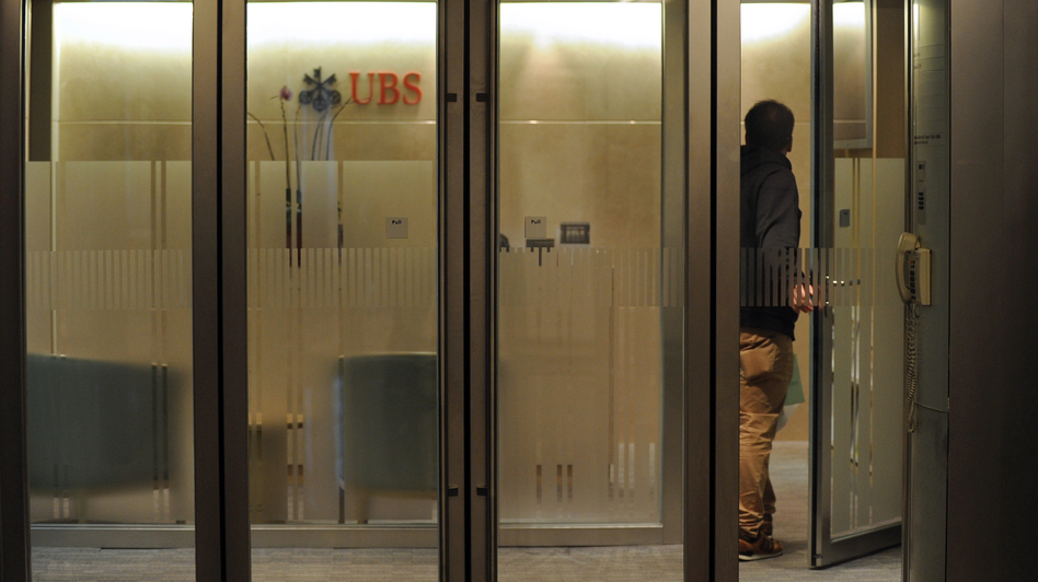 A man enters a UBS bank in Hong Kong last month. The Swiss banking giant agreed in 2009 to identify the names of its U.S. account holders, part of a push by banking regulators to make it harder to hide income.
