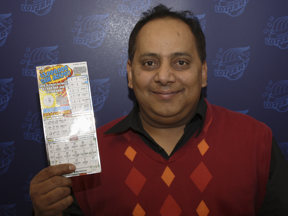 Urooj Khan, with his winning lottery ticket. Not long after this photo was taken, he was dead.