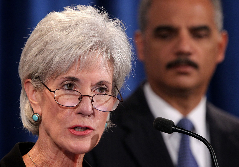 Health and Human Services Secretary Kathleen Sebelius speaks as Attorney General Eric Holder listens during a news conference last October. The two plan to remain in their current jobs as President Obama's second term begins. Health and Human Services Secretary Kathleen Sebelius speaks as Attorney General Eric Holder listens during a news conference last October. The two plan to remain in their current jobs as President Obama's second term begins.