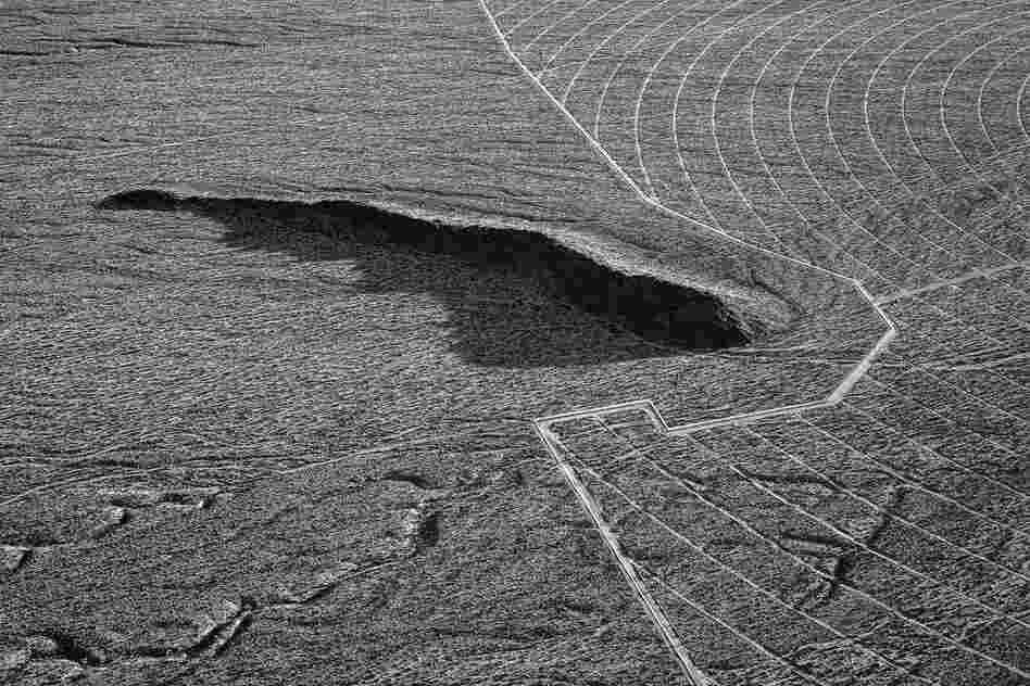Early fencing and ground preparation around a geological formation. April 2012.