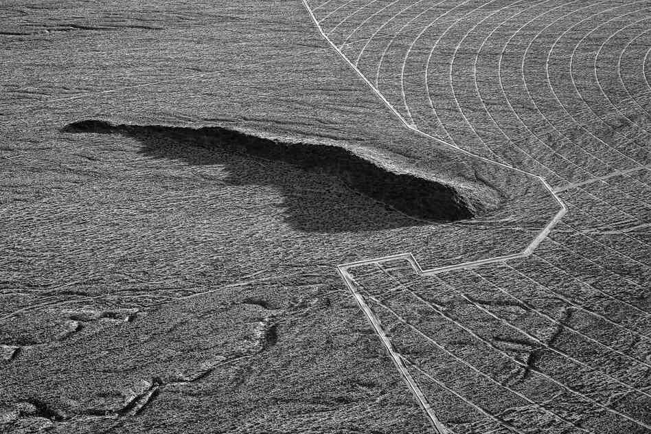 Early fencing and ground preparation around a geological formation. April 2012.