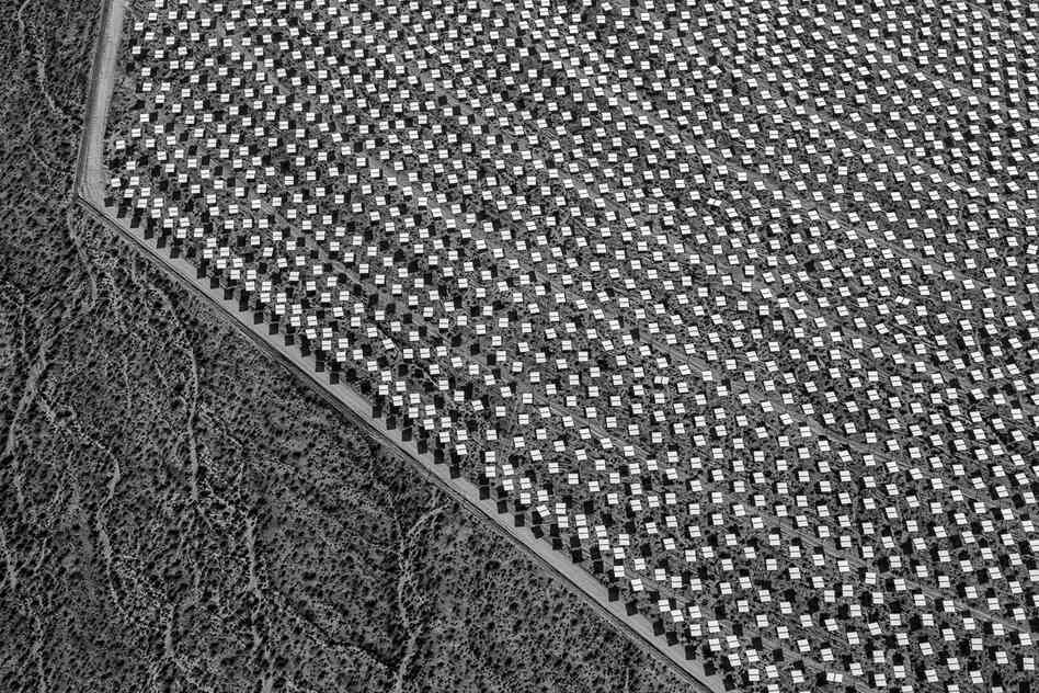 The heliostats in Solar Field One run up against an undisturbed desert terrain. June 2012.