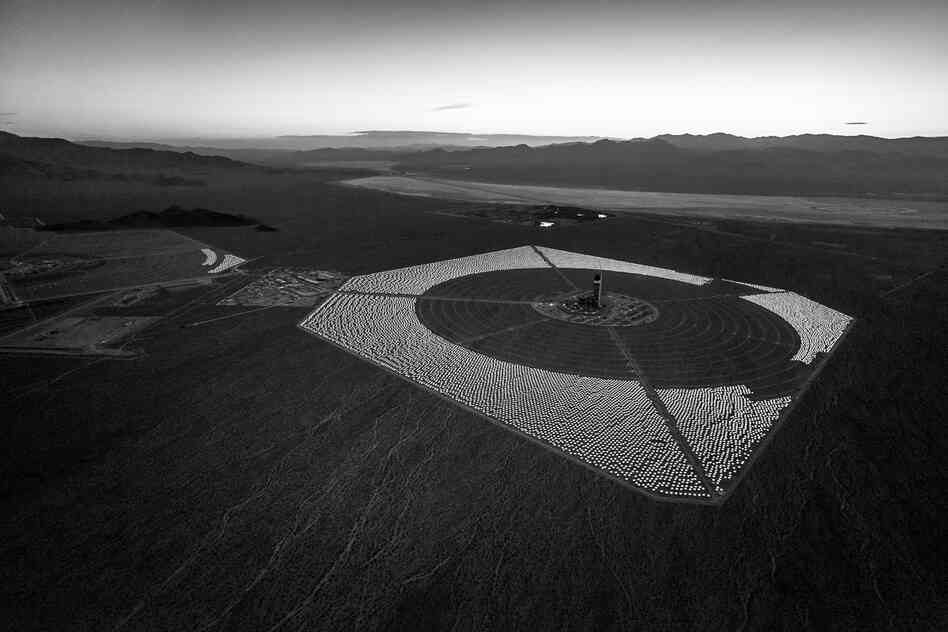 Solar Field One before dawn. The field of heliostats has been partially installed around the tower and power block. April 2012.