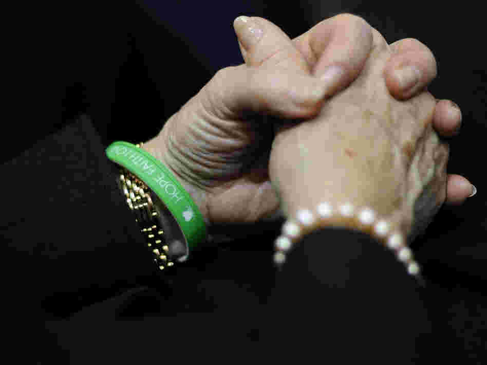 Newtown Schools Superintendent Janet Robinson wears a bracelet reading Hope, Faith, Love in the school colors of Sandy Hook Elementary during Gov. Dannel Malloy's State of the State address at the Capitol in Hartford, Conn., on Wednesday.