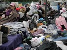Volunteers sort through piles of donated clothes for Superstorm Sandy victims at an impromptu Staten Island aid station in November. Relief groups are still trying to figure out what to do with donated clothes people sent to New York and New Jersey in Sandy's aftermath. Volunteers sort through piles of donated clothes for Superstorm Sandy victims at an impromptu Staten Island aid station in November. Relief groups are still trying to figure out what to do with donated clothes people sent to New York and New Jersey in Sandy's aftermath.