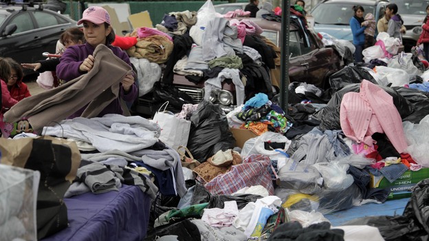 Volunteers sort through piles of donated clothes for Superstorm Sandy victims at an impromptu Staten Island aid station in November. Relief groups are still trying to figure out what to do with donated clothes people sent to New York and New Jersey in Sandy's aftermath.