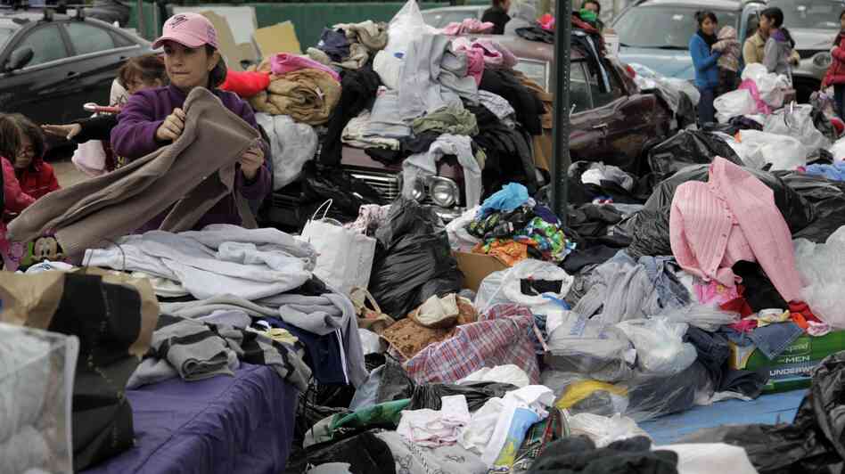 Volunteers sort through piles of donated clothes for Superstorm Sandy victims at an impromptu Staten Island aid station in November. Relief groups are still trying to figure out what to do with donated clothes people sent to New York and New Jersey in Sandy's aftermath.