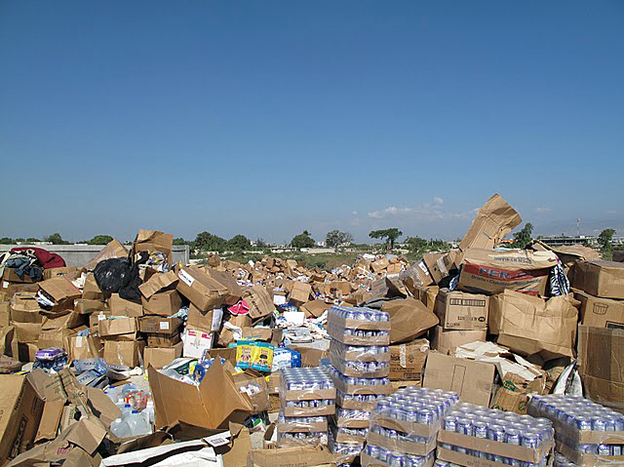 Unsolicited donations of used clothing, bottled water, canned food and personal grooming products piled up following the 2010 earthquake in Haiti. The piles had to be moved aside to make room to stage and deliver critical relief supplies.