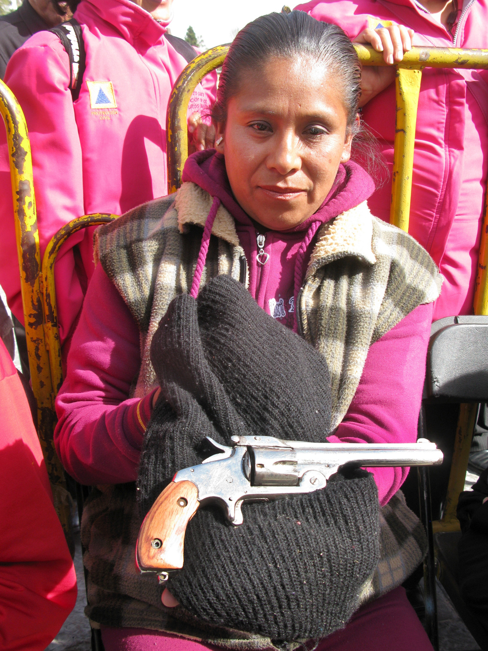 In Mexico City, Sara Martinez Franco holds a .38-caliber revolver that belonged to her grandfather. She traded in the weapon — which she says was used during the Mexican Revolution — under the buyback program.