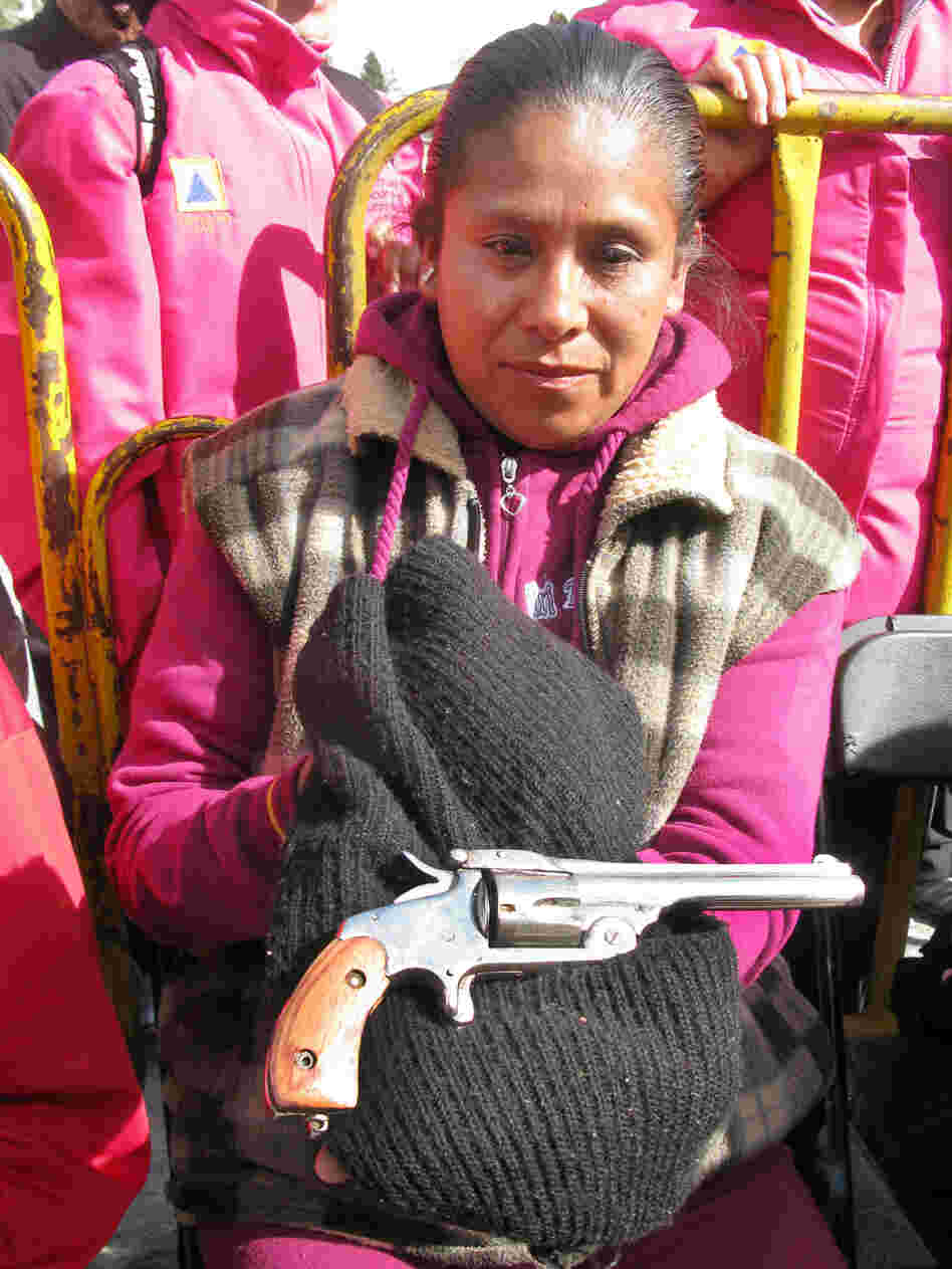 In Mexico City, Sara Martinez Franco holds a .38-caliber revolver that belonged to her grandfather. She traded in the weapon — which she says was used during the Mexican Revolution — under the buyback program.
