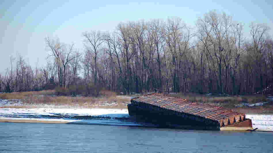 The river has fallen fast enough that barges have been beached along its banks outside St. Louis. The river has fallen fast enough that barges have been beached along its banks outside St. Louis.