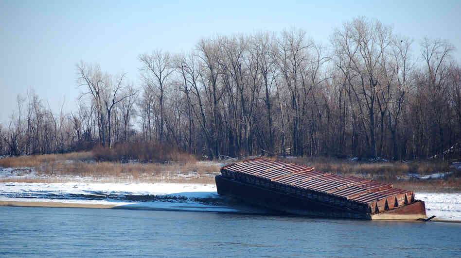 The river has fallen fast enough that barges have been beached along its banks outside St. Louis. The river has fallen fast enough that barges have been beached along its banks outside St. Louis.