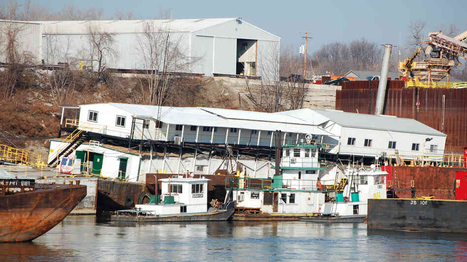 The offices of JB Marine, a barge cleaning and repair business that is located atop an empty barge just south of St. Louis, now lean at a 30-degree angle because the Mississippi River levels are so low. The offices of JB Marine, a barge cleaning and repair business that is located atop an empty barge just south of St. Louis, now lean at a 30-degree angle because the Mississippi River levels are so low.