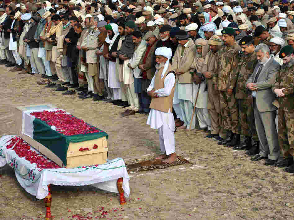 Tuesday in the Pakistani village of Khairpur, officials and relatives gathered at the coffin of the Pakistani soldier killed Sunday in a skirmish with Indian troops.