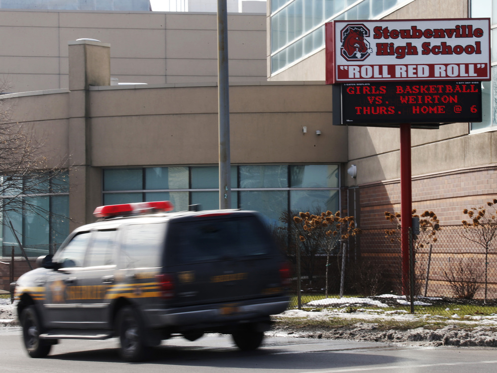 A sheriff's vehicle patrols Steubenville High School on Tuesday, after the city's schools were locked down due to an alleged shooting threat made via Twitter.