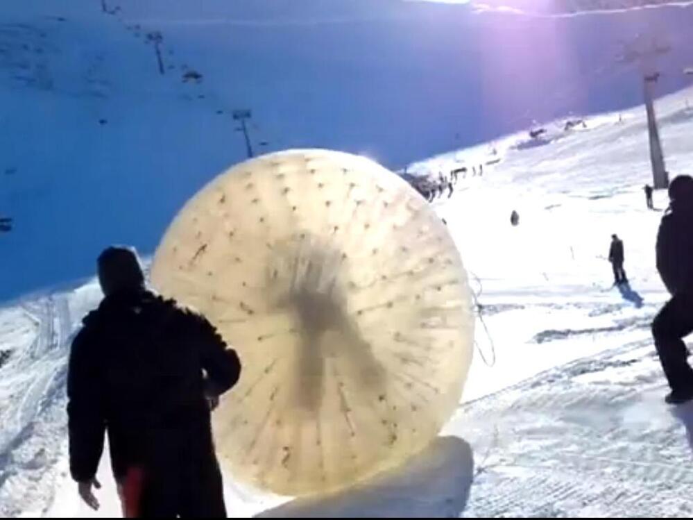 A screen image from video of the "zorb" as it began rolling down a mountain in southern Russia last week. One of the two men inside would die from injuries received after it careened into a ravine.