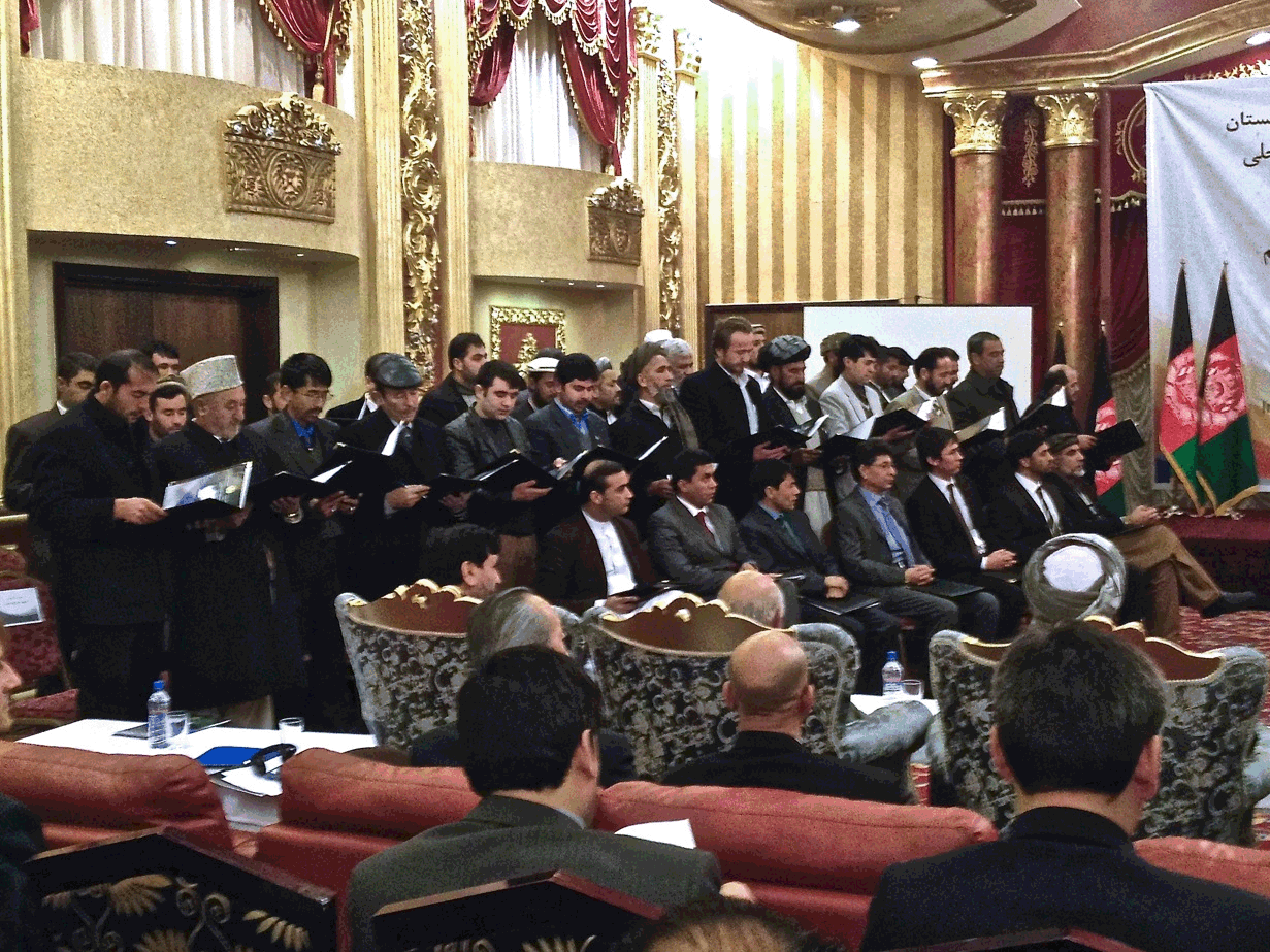 Deputy provincial governors and district governors selected under a new merit-based program are sworn in Tuesday in Kabul. The development is part of an effort to address rampant corruption in Afghanistan. (Image credit: NPR)