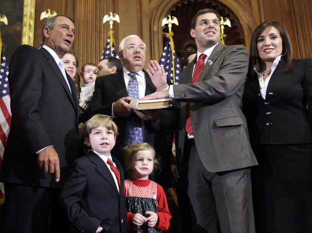 Republican House Speaker John Boehner administers the oath of office to Amash during a mock swearing-in ceremony on Jan. 5, 2011, at the start of Amash's first term.