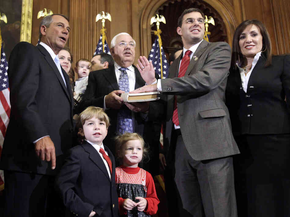 Republican House Speaker John Boehner administers the oath of office to Amash during a mock swearing-in ceremony on Jan. 5, 2011, at the start of Amash's first term.