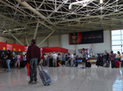 A traveler stands at the check-in lobby at Havana's Jose Marti International Airport last year. On Jan. 14, Cuba scraps a much-reviled, decades-old exit permit requirement, easing most Cubans' exit and return. A traveler stands at the check-in lobby at Havana's Jose Marti International Airport last year. On Jan. 14, Cuba scraps a much-reviled, decades-old exit permit requirement, easing most Cubans' exit and return.