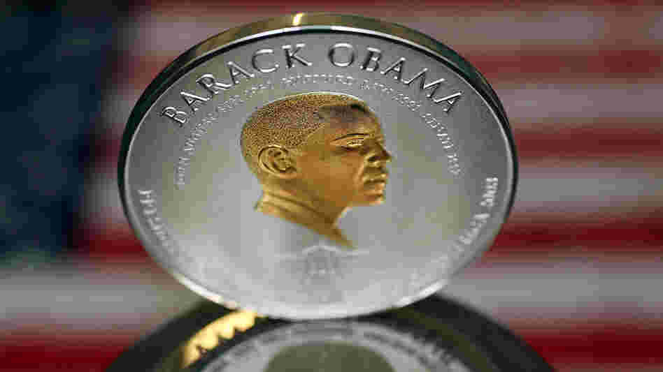 No, this isn't worth $1 trillion. It's a commemorative coin minted in the U.K. in 2008. But some have suggested the president's image should be on it if he orders up a $1 trillion coin.