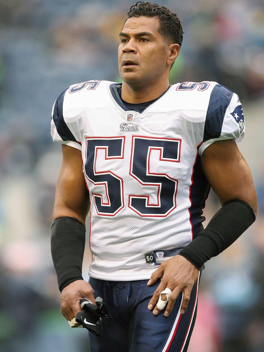 Junior Seau, seen here playing for the New England Patriots toward the end of his career, suffered from a degenerative brain disease, scientists say.