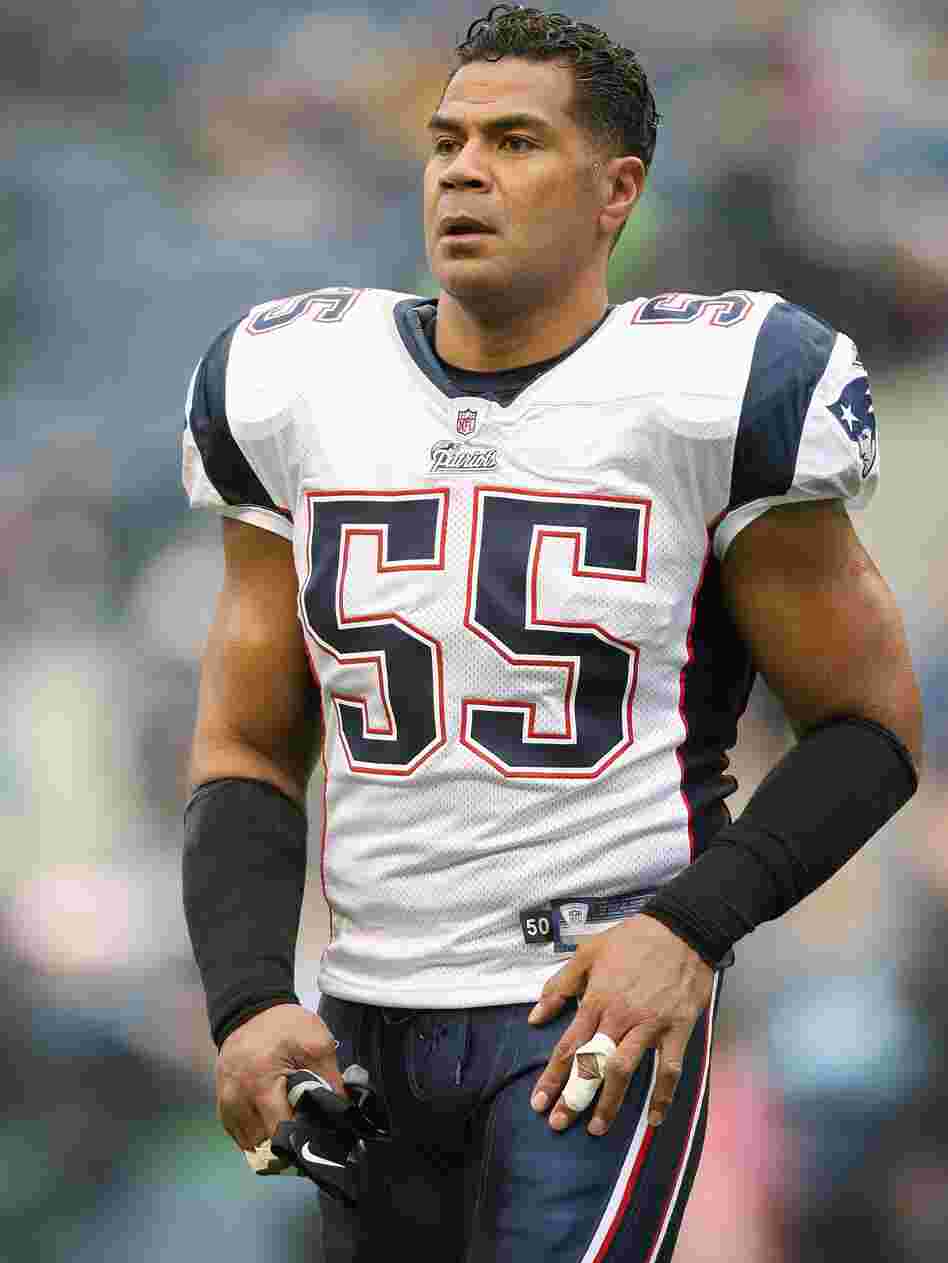 Junior Seau, seen here playing for the New England Patriots toward the end of his career, suffered from a degenerative brain disease, scientists say.